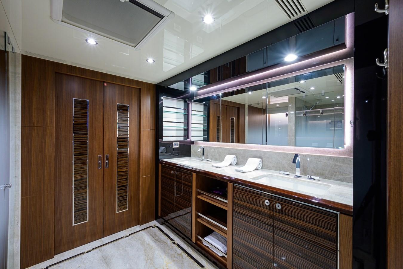 a bathroom with a large mirror aboard ZEPHYR Yacht for Sale