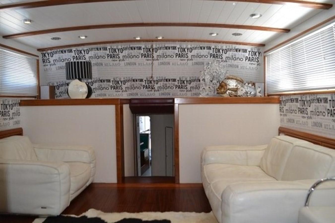 a room with couches and a sign on the wall aboard ADEVIYE Yacht for Sale