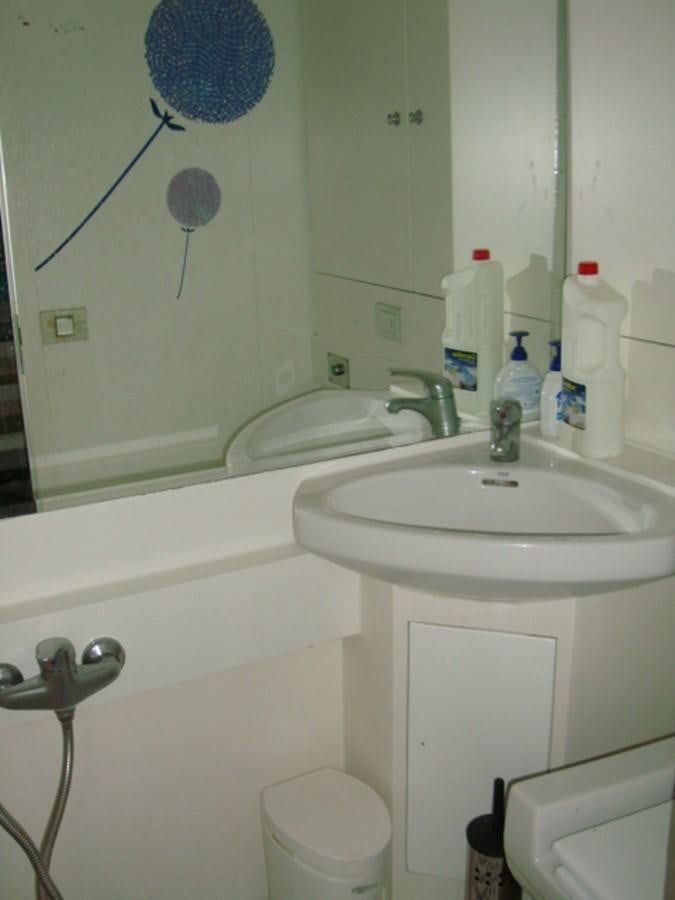 a bathroom with a sink and a mirror aboard ADEVIYE Yacht for Sale