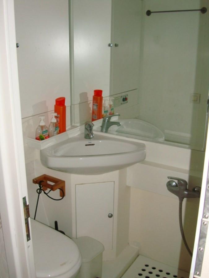 a bathroom with a sink and toilet aboard ADEVIYE Yacht for Sale