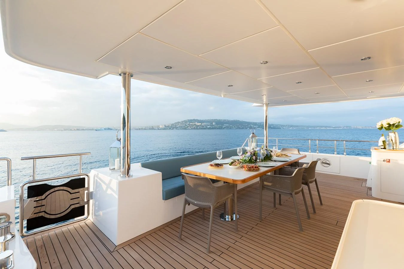a table and chairs on a boat aboard JEWEL Yacht for Sale