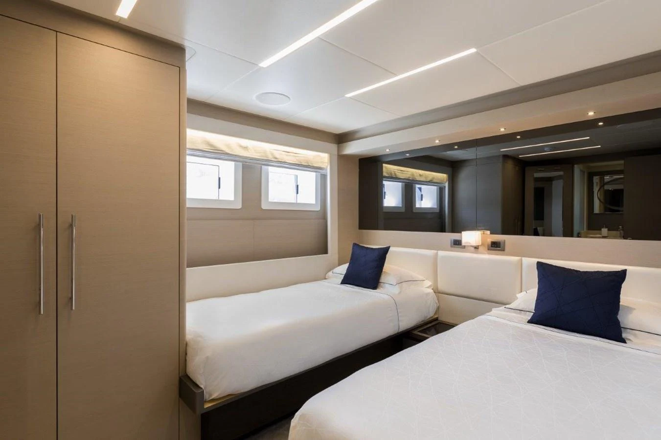 a room with two beds aboard JEWEL Yacht for Sale