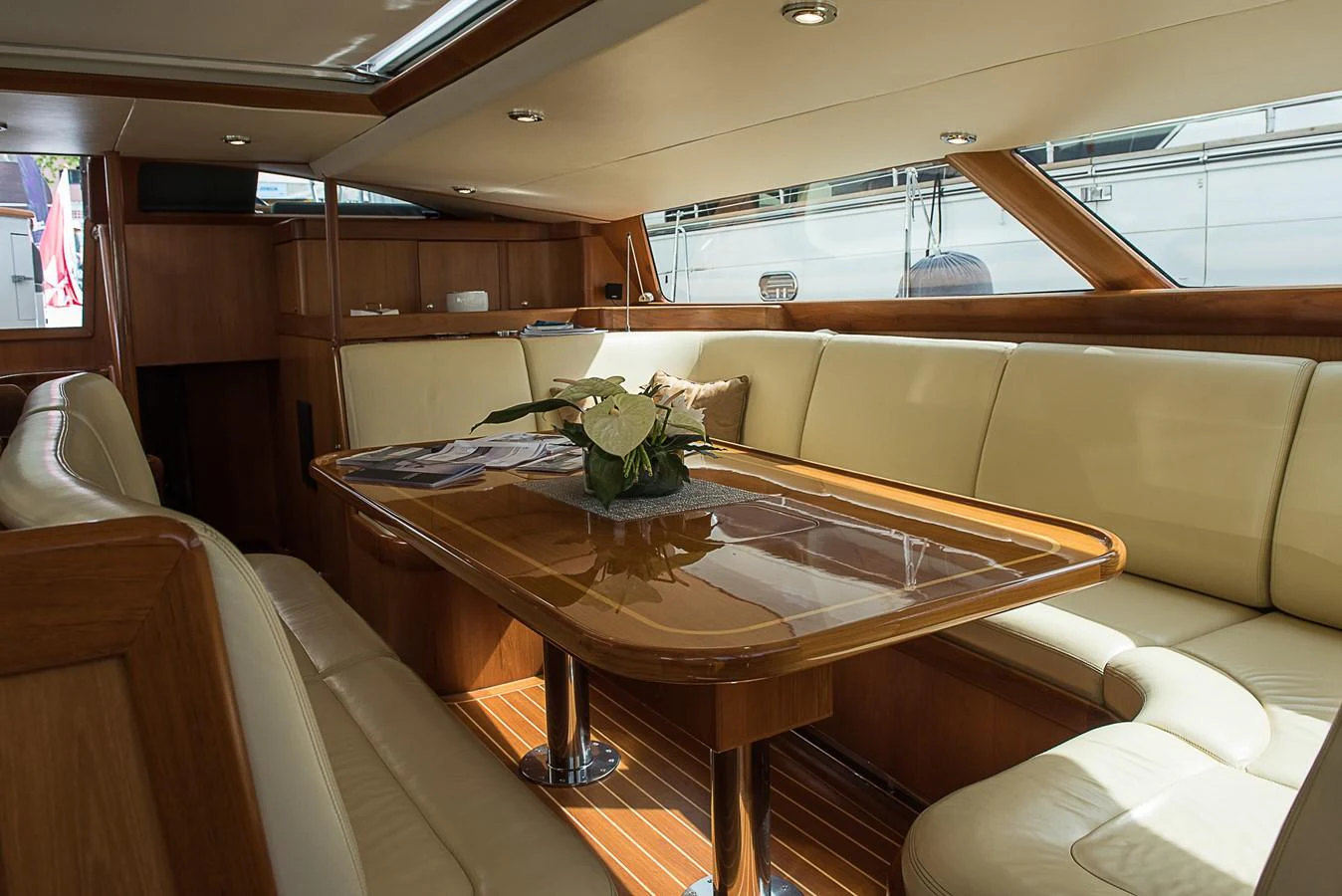 a room with a table and chairs aboard SINDONEMO Yacht for Sale
