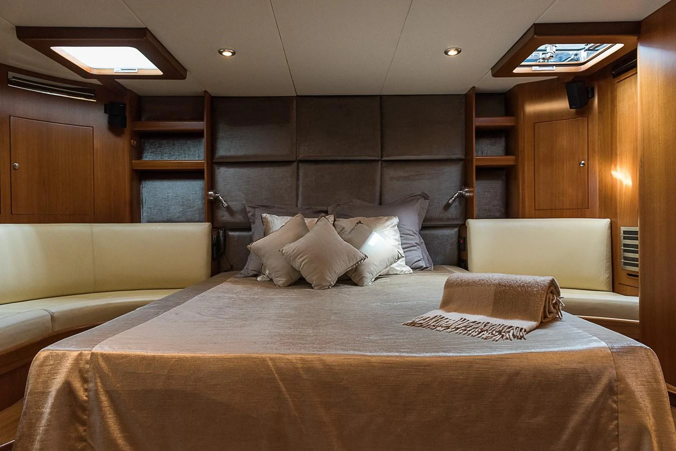 a bed with white pillows aboard SINDONEMO Yacht for Sale