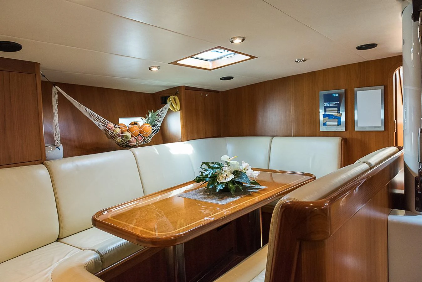 a room with a table and chairs aboard SINDONEMO Yacht for Sale