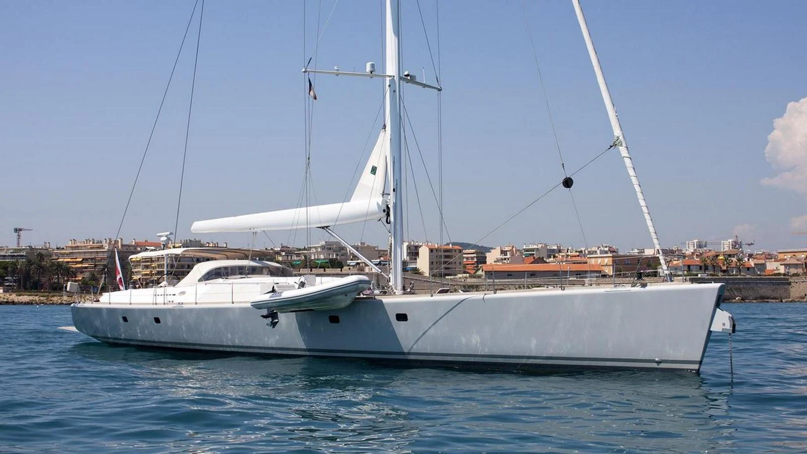 a white boat in the water aboard SINDONEMO Yacht for Sale