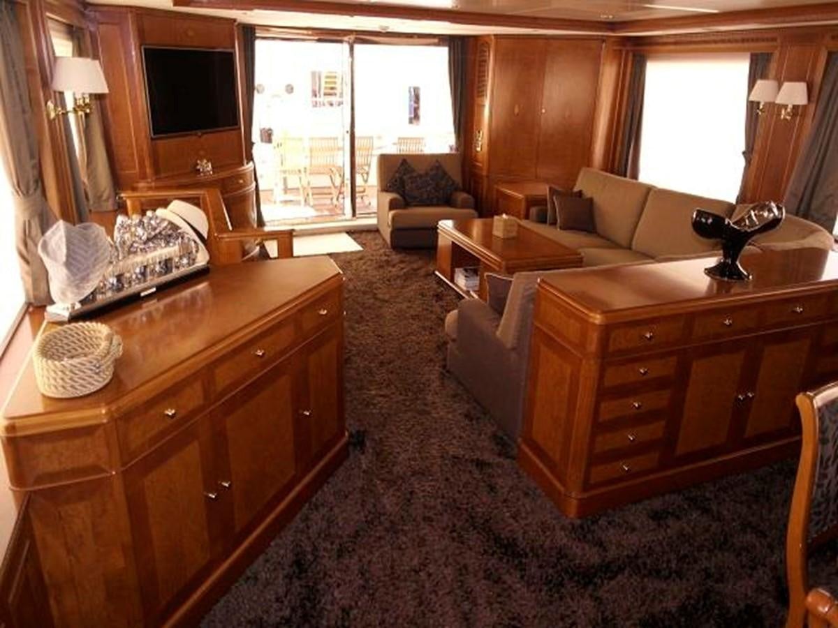 a living room with a couch and a desk aboard BENETTI TRADITION 100 Yacht for Sale