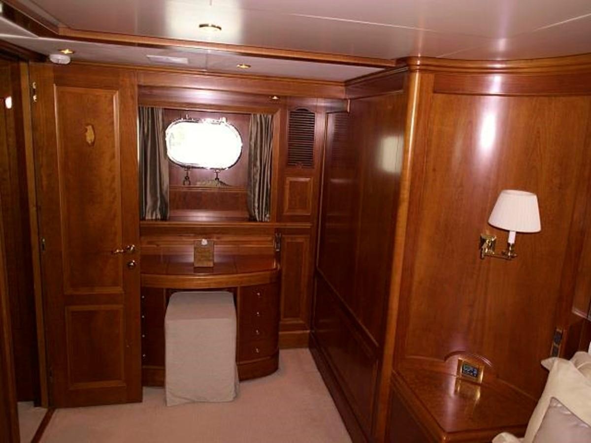 a room with wooden cabinets aboard BENETTI TRADITION 100 Yacht for Sale