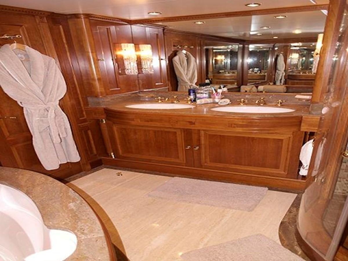a bathroom with a large mirror aboard BENETTI TRADITION 100 Yacht for Sale
