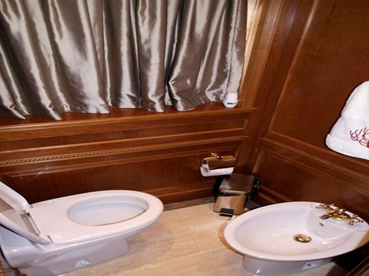 a bathroom with a toilet and sink aboard BENETTI TRADITION 100 Yacht for Sale
