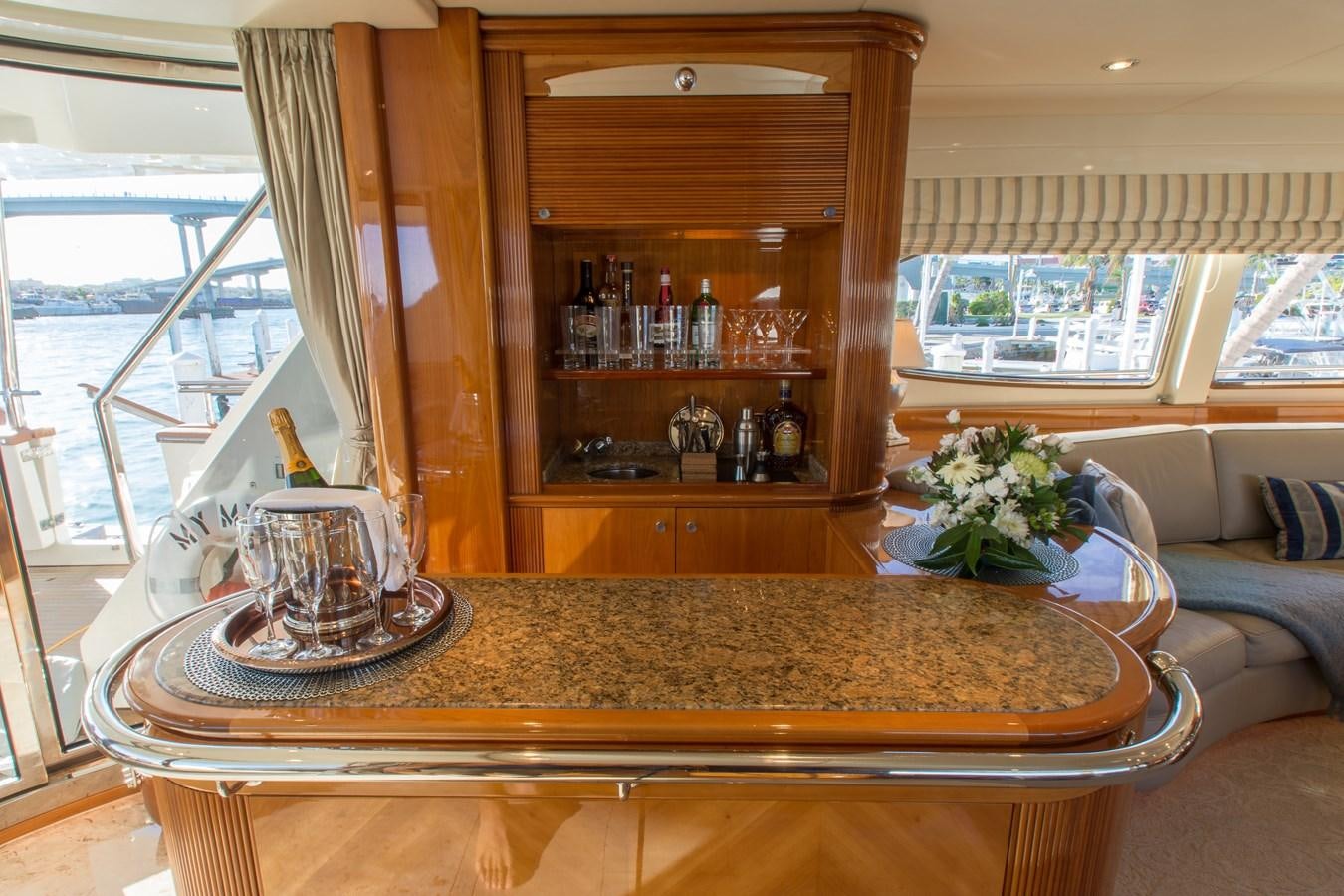 a glass table in a room aboard NO NAME AZIMUT 100 JUMBO Yacht for Sale
