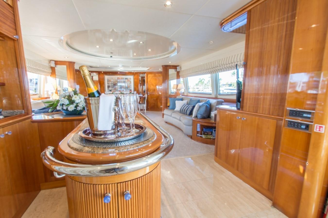 a room with a round table and a large white chandelier aboard NO NAME AZIMUT 100 JUMBO Yacht for Sale
