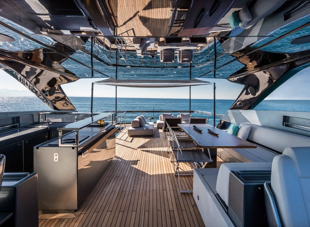 a deck with a deck and chairs aboard BESO Yacht for Sale