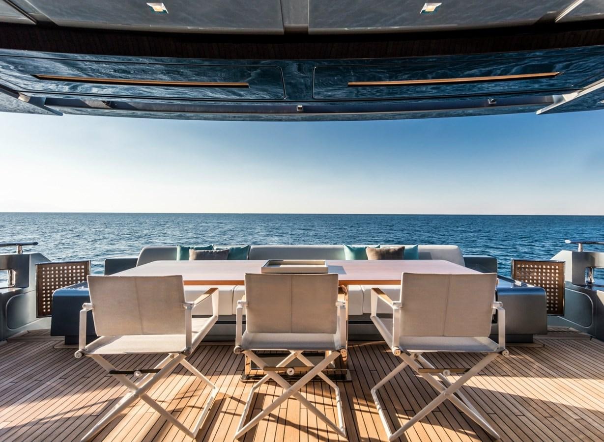 a deck with chairs and a pool aboard BESO Yacht for Sale