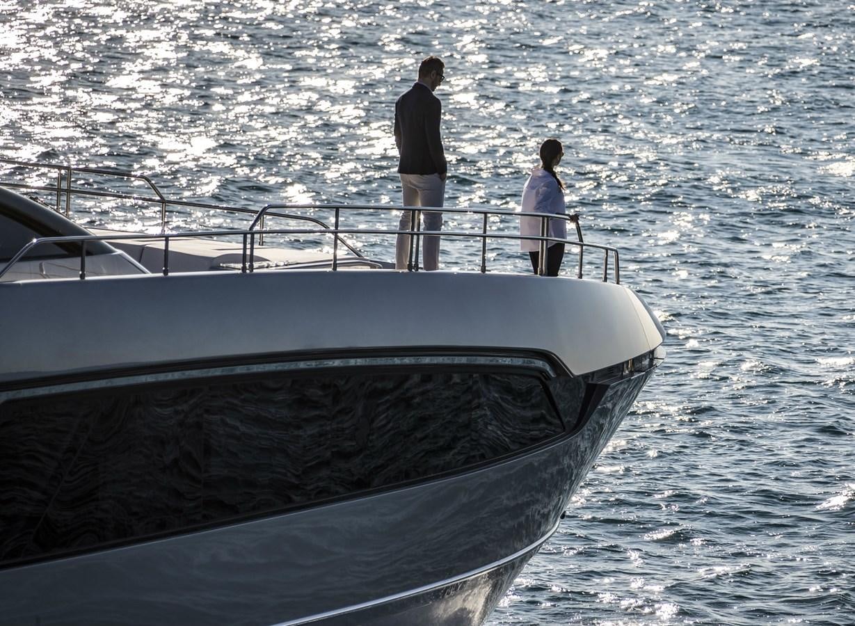 a man and a woman standing on a boat in the water aboard BESO Yacht for Sale