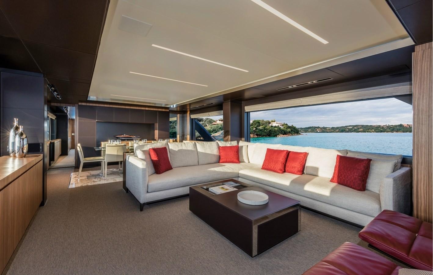 a living room with a couch and a table aboard BESO Yacht for Sale