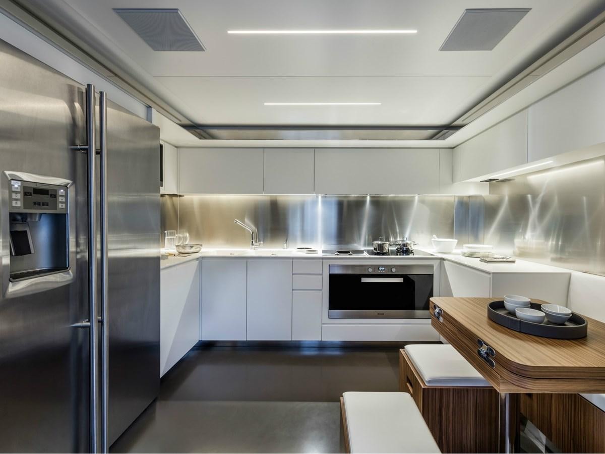 a kitchen with a glass door aboard BESO Yacht for Sale