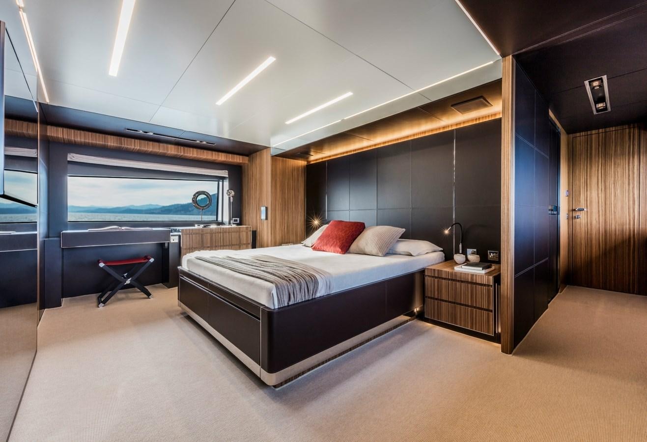 a large bedroom with a large bed aboard BESO Yacht for Sale