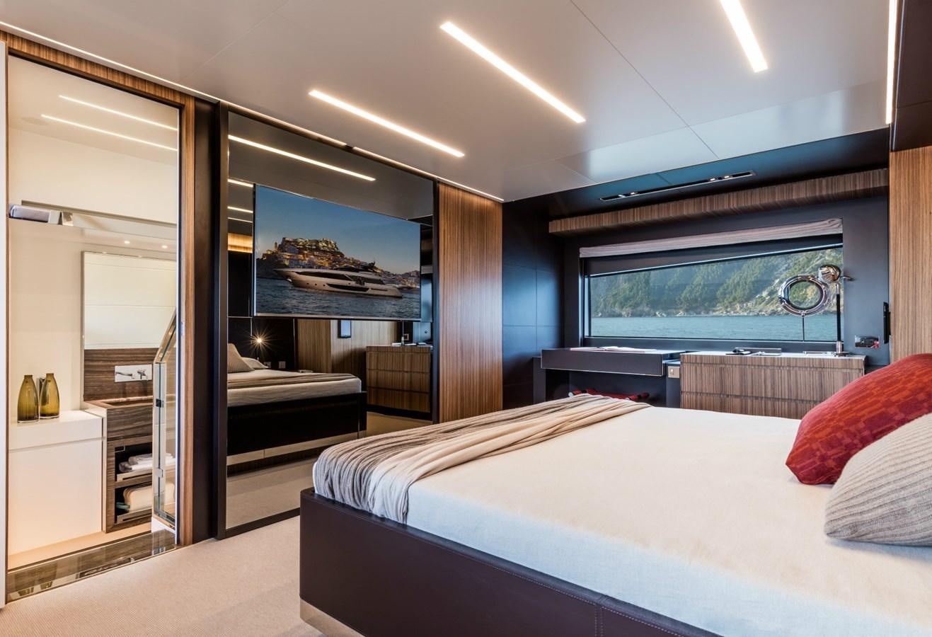 a bedroom with a large bed aboard BESO Yacht for Sale