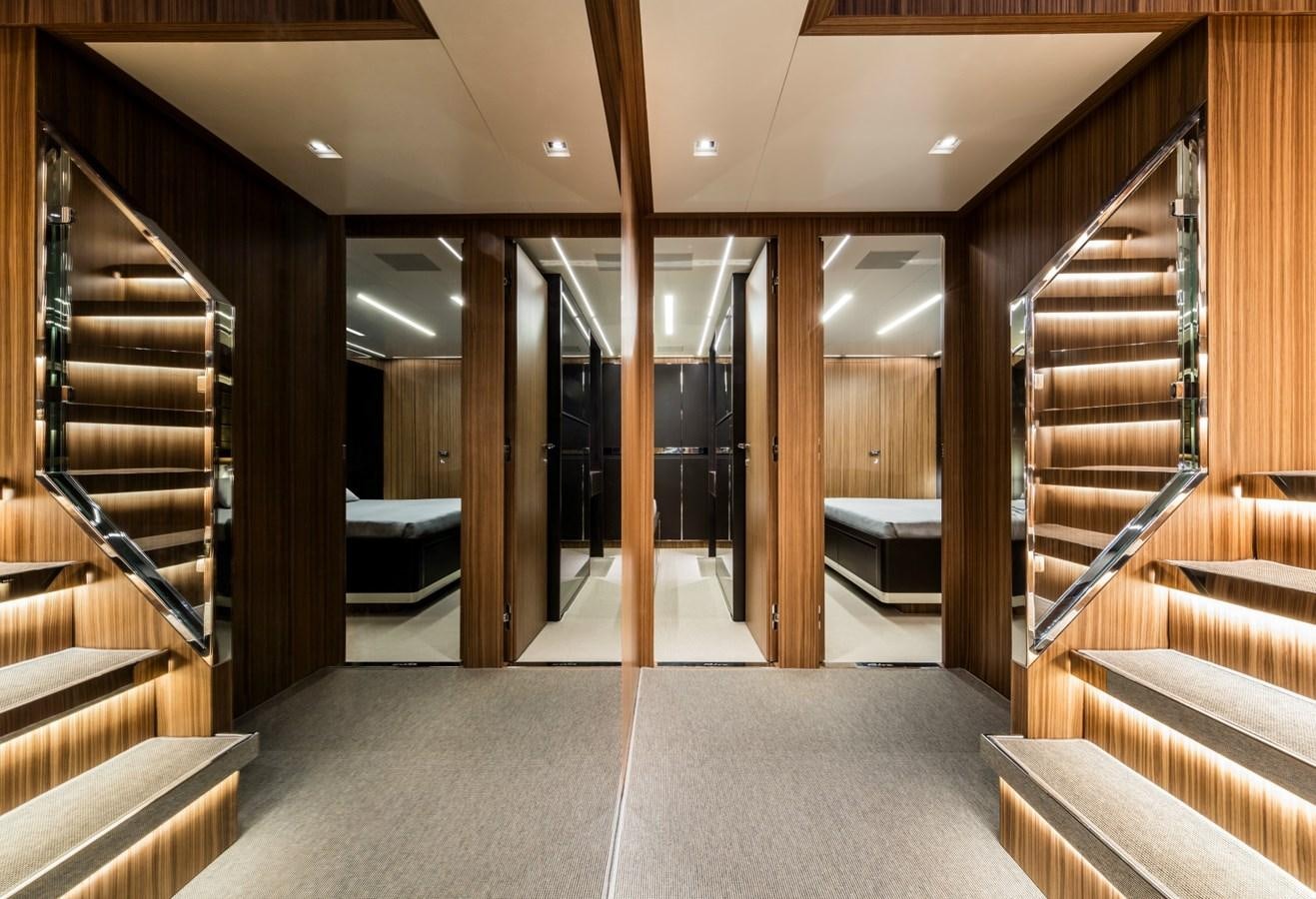 a room with wooden walls and a staircase aboard BESO Yacht for Sale