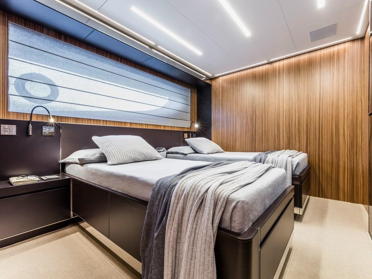 a room with a bed and a window aboard BESO Yacht for Sale