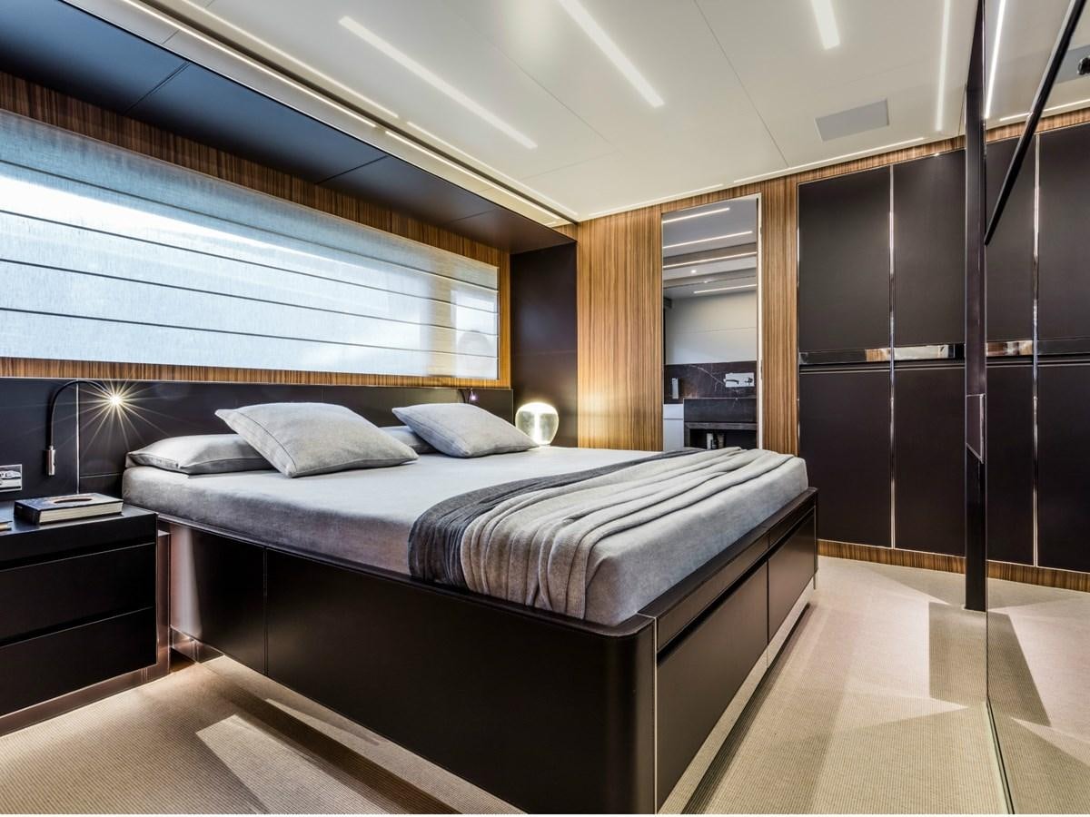 a room with a bed and a window aboard BESO Yacht for Sale