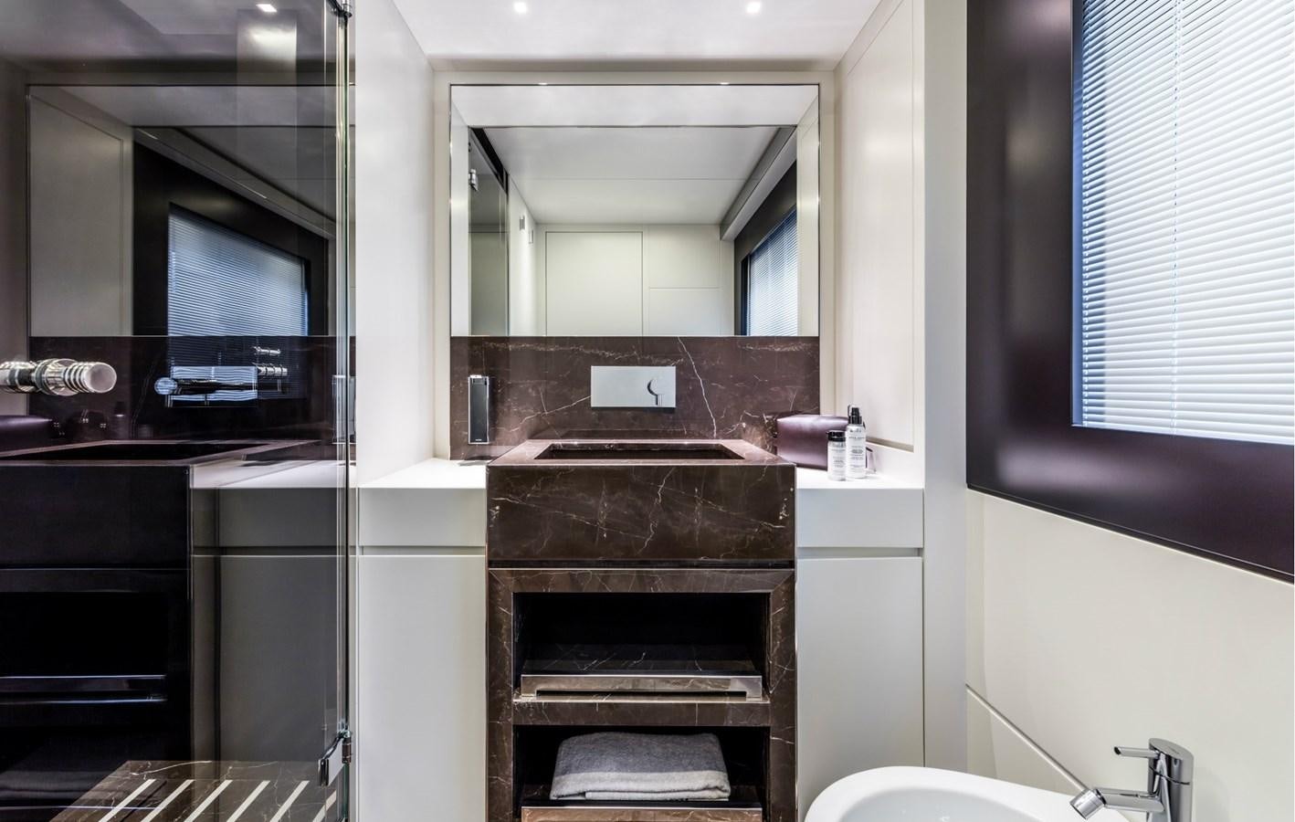 a bathroom with a sink and a mirror aboard BESO Yacht for Sale