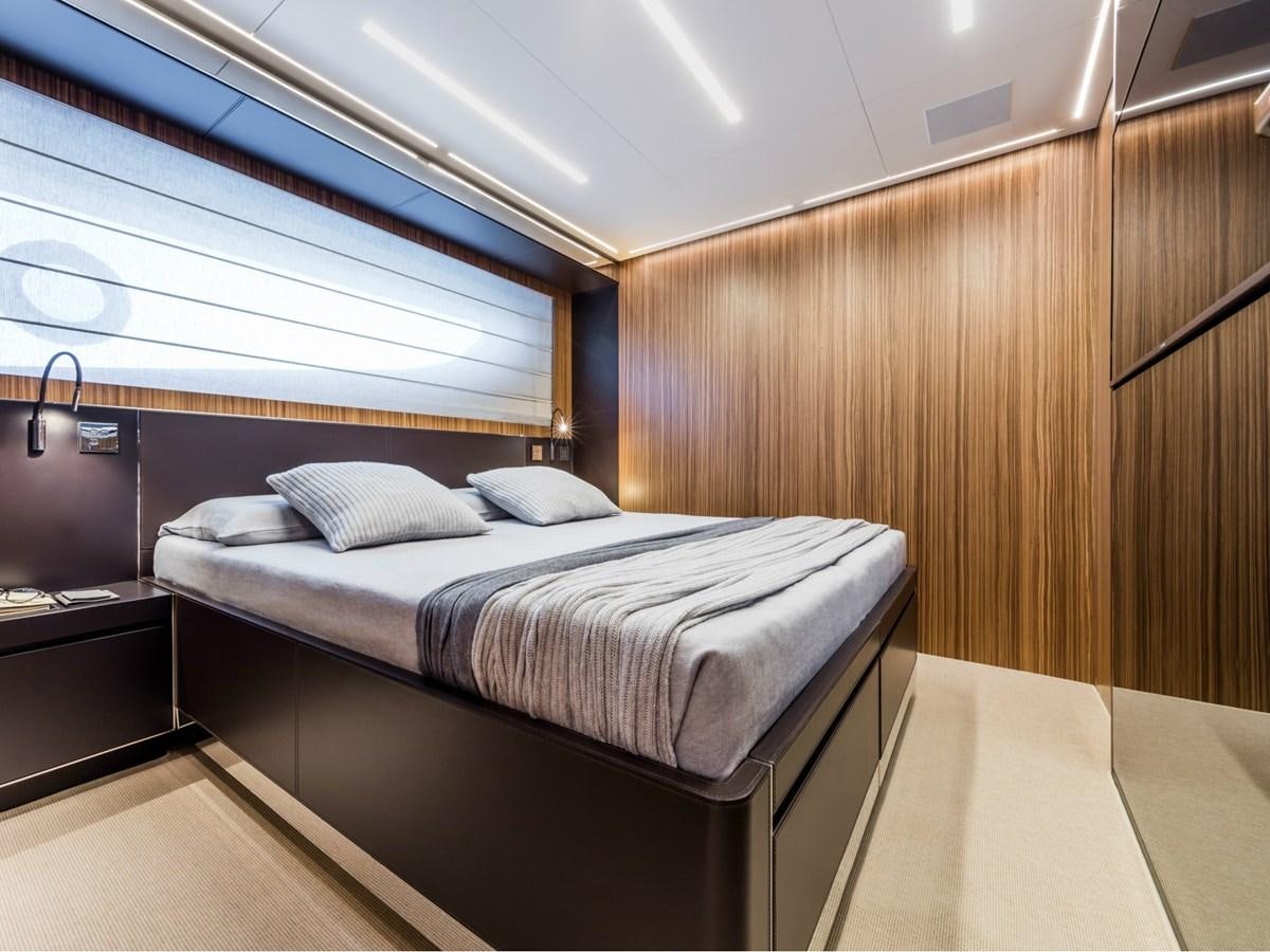 a room with a bed and a window aboard BESO Yacht for Sale