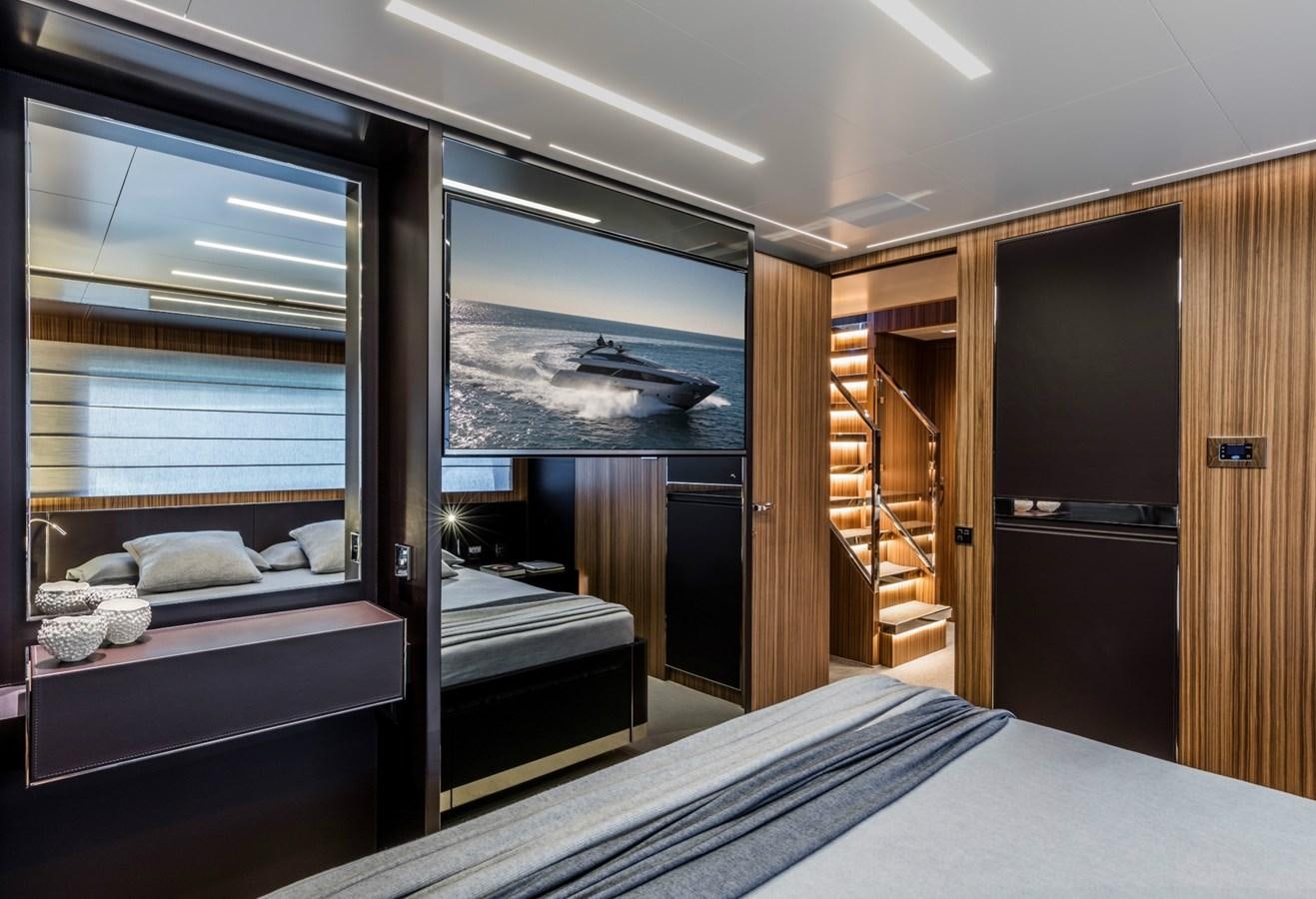 a room with a bed and a window aboard BESO Yacht for Sale