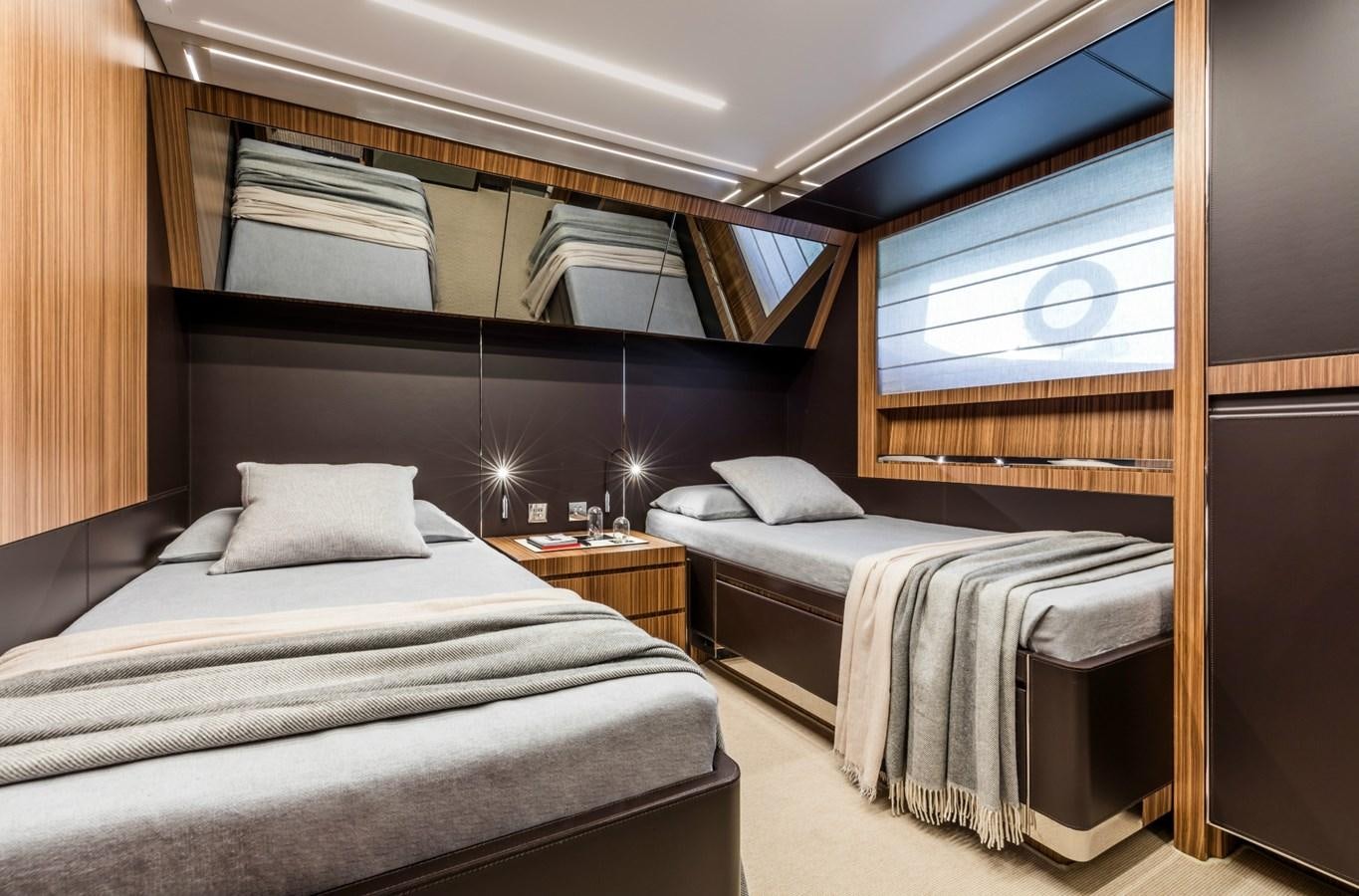 a room with two beds aboard BESO Yacht for Sale