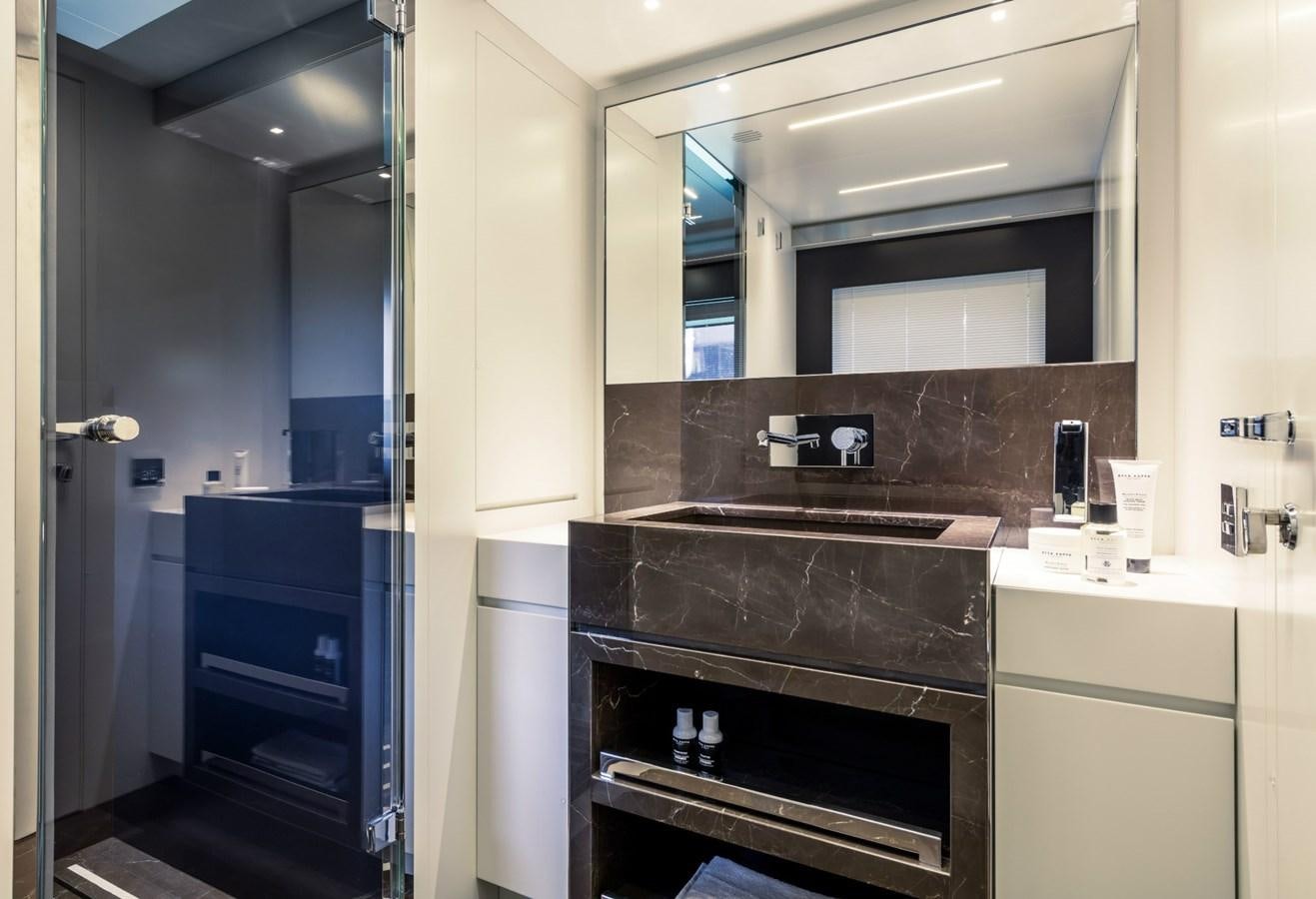 a bathroom with a sink and a mirror aboard BESO Yacht for Sale