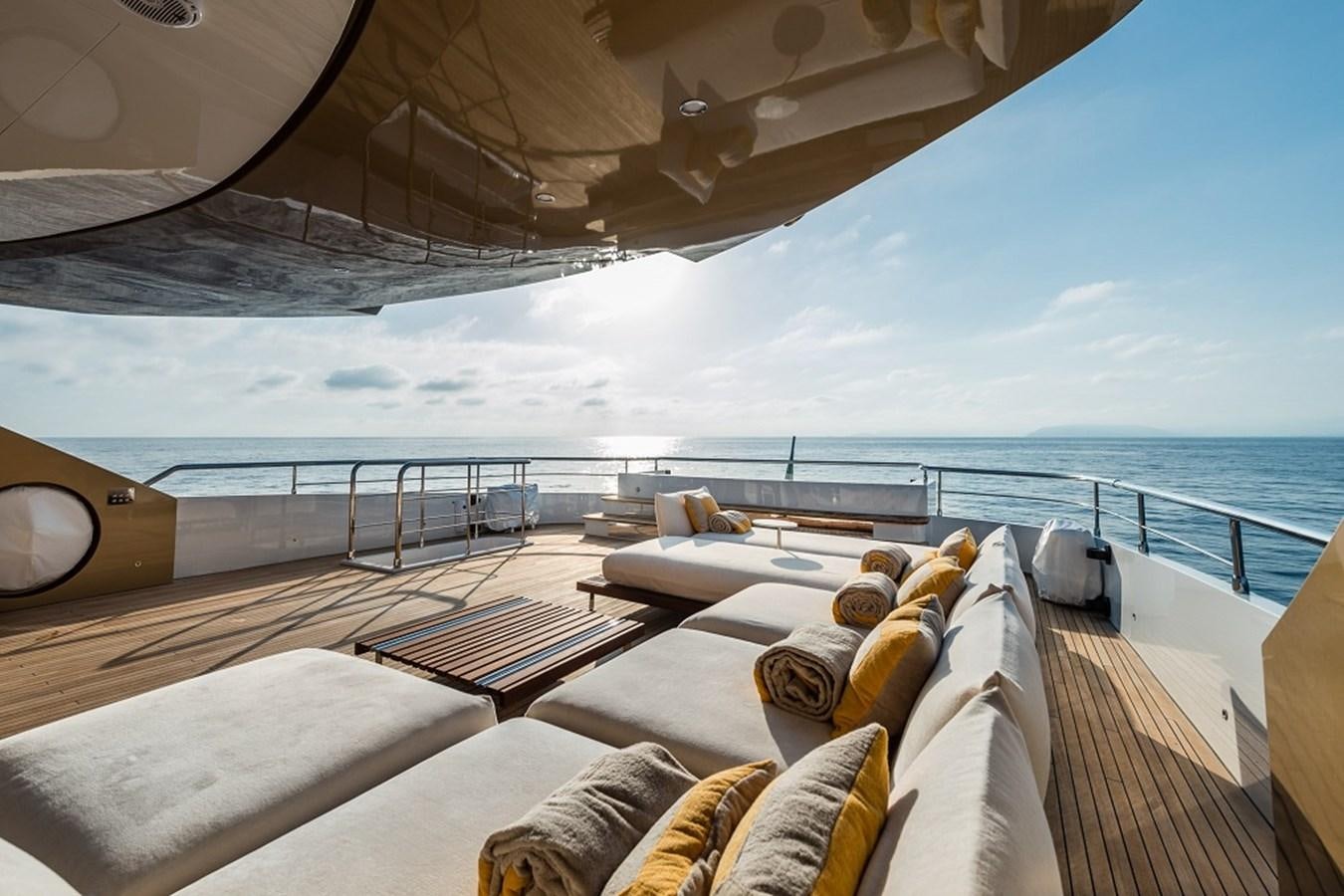 a deck with a view of the ocean and the ocean aboard TABOO OF THE SEAS Yacht for Sale