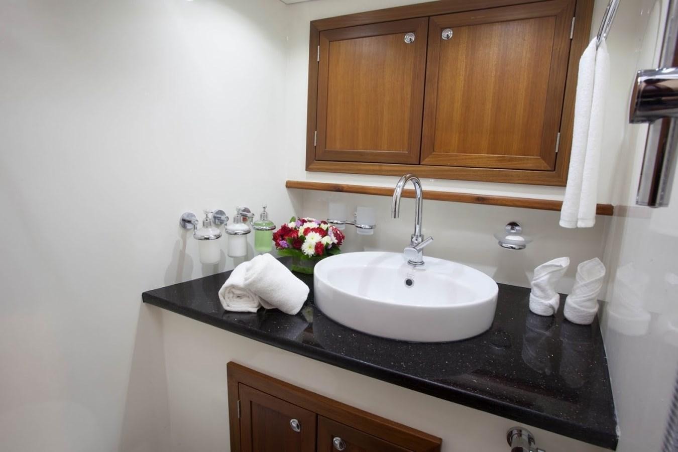 a bathroom with a sink and cabinets aboard DALLINGHOO Yacht for Sale
