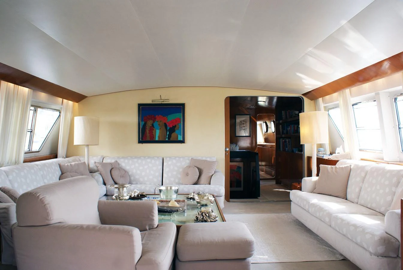 a living room with a fireplace aboard LUC AN Yacht for Sale