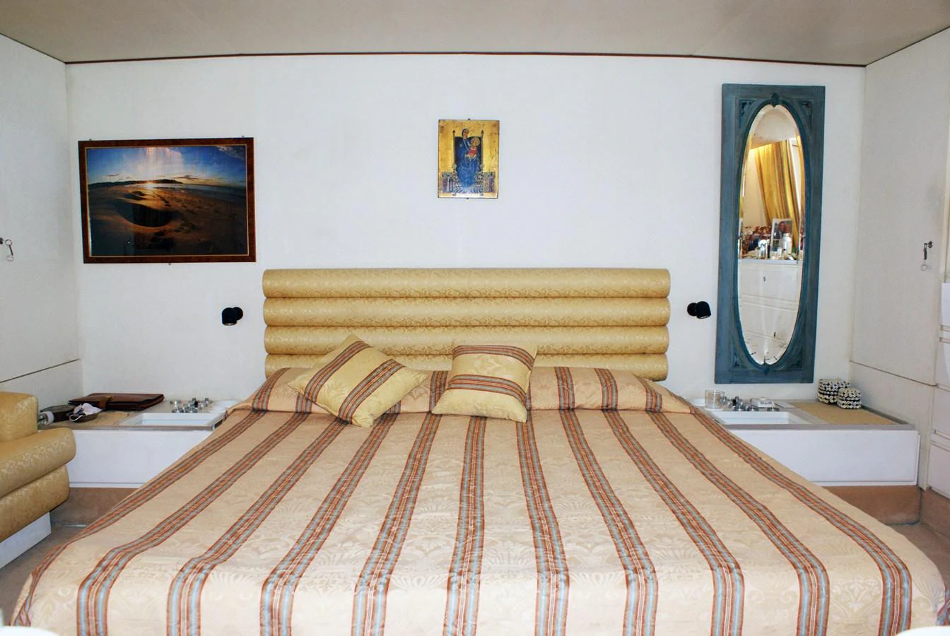 a bed with a mirror above it aboard LUC AN Yacht for Sale
