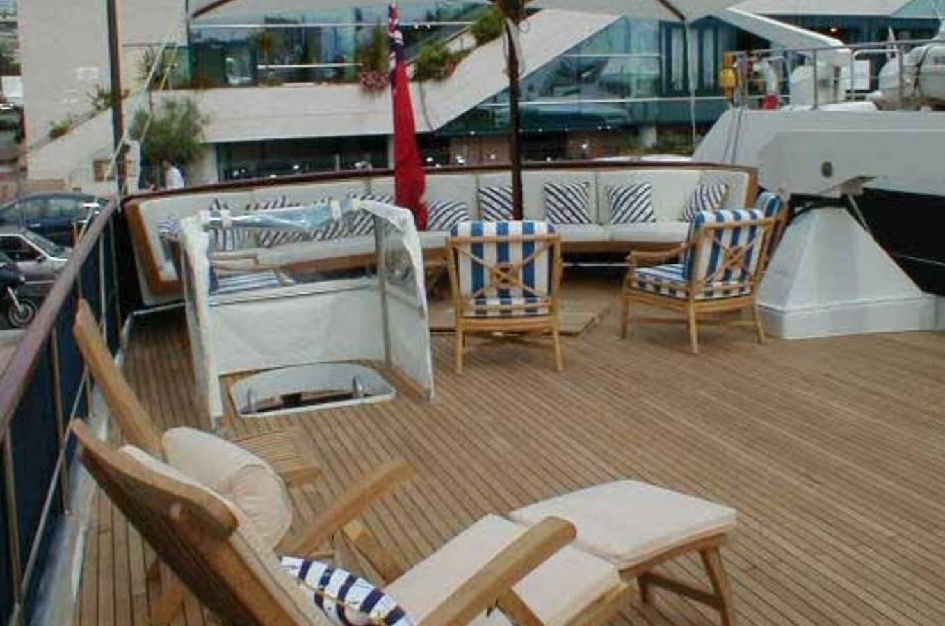 a deck with chairs and tables aboard MISS EVA Yacht for Sale