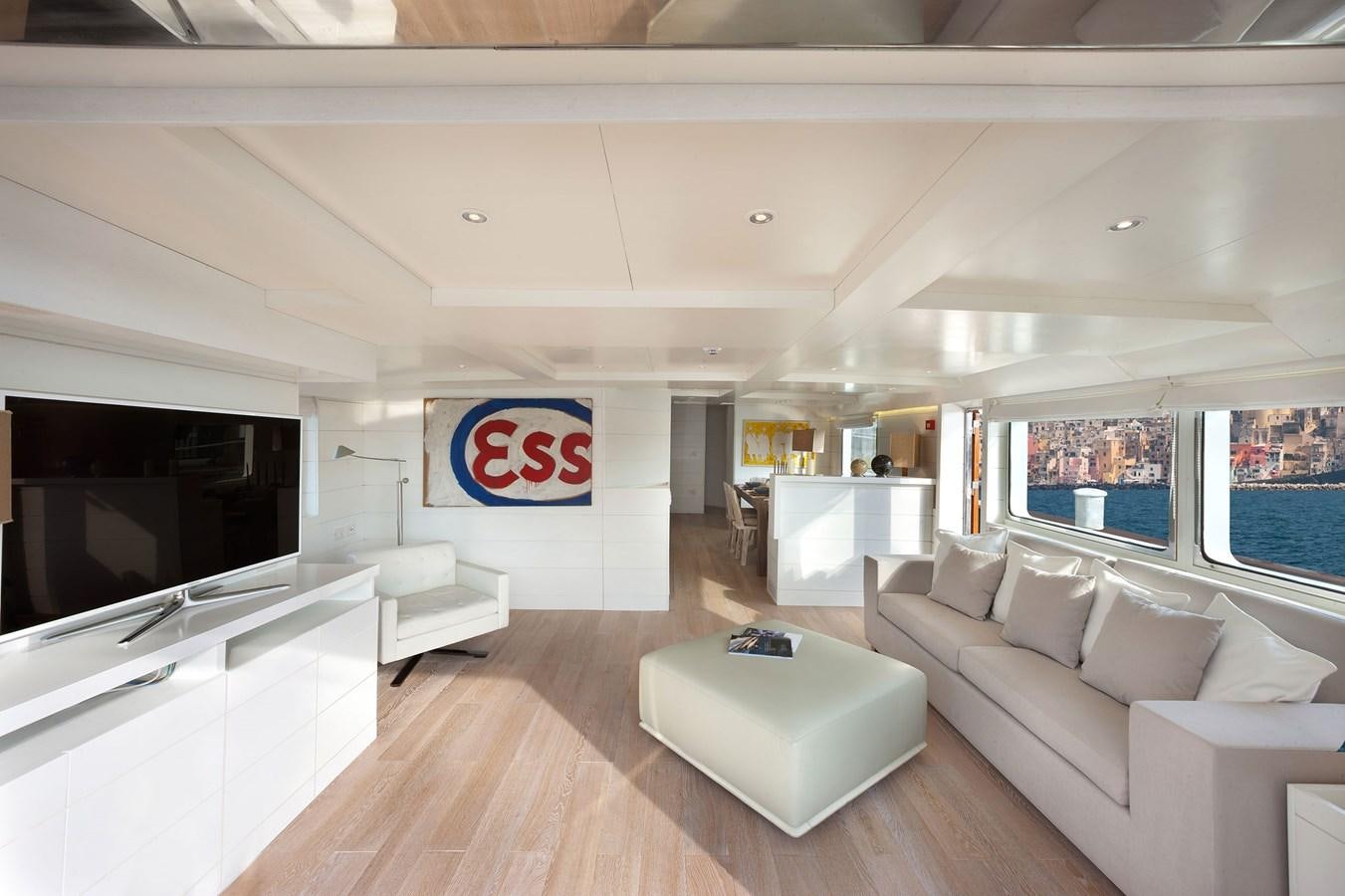 a large living room with a large window aboard VERVECE Yacht for Charter
