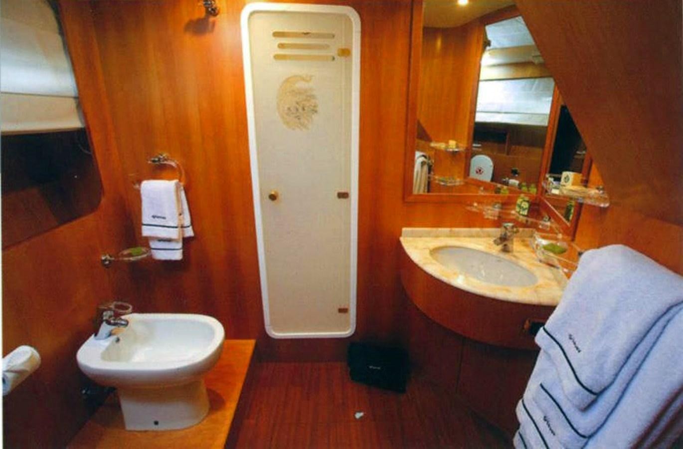 a bathroom with a sink and a mirror aboard GIAVA Yacht for Sale