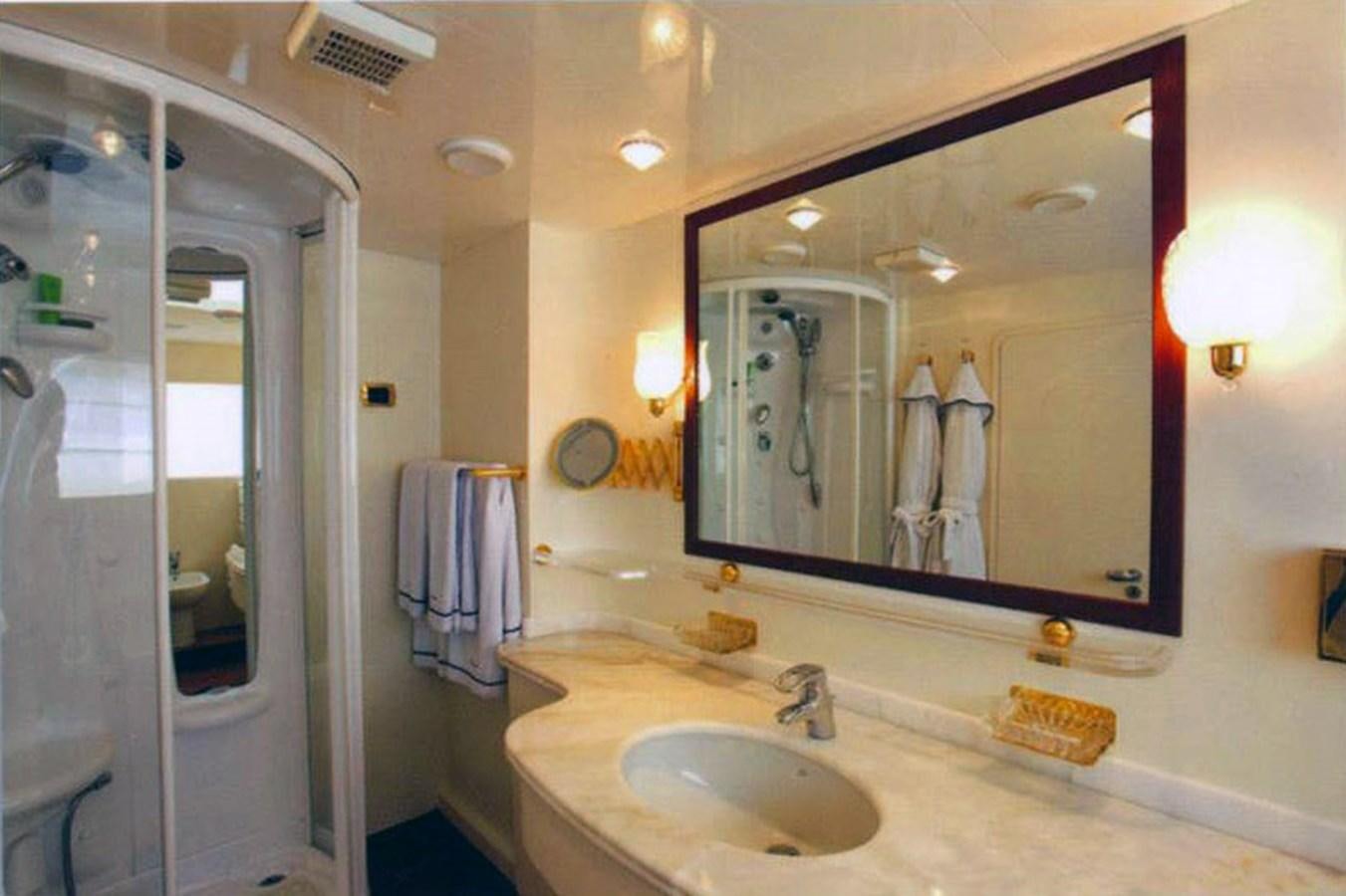 a bathroom with a large mirror aboard GIAVA Yacht for Sale