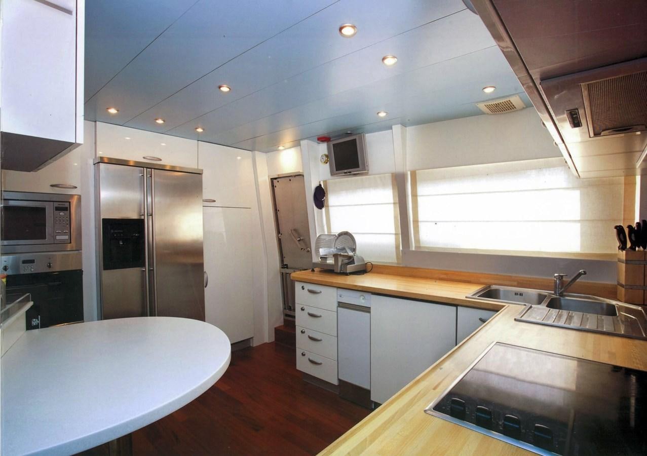 a kitchen with a large island aboard GIAVA Yacht for Sale