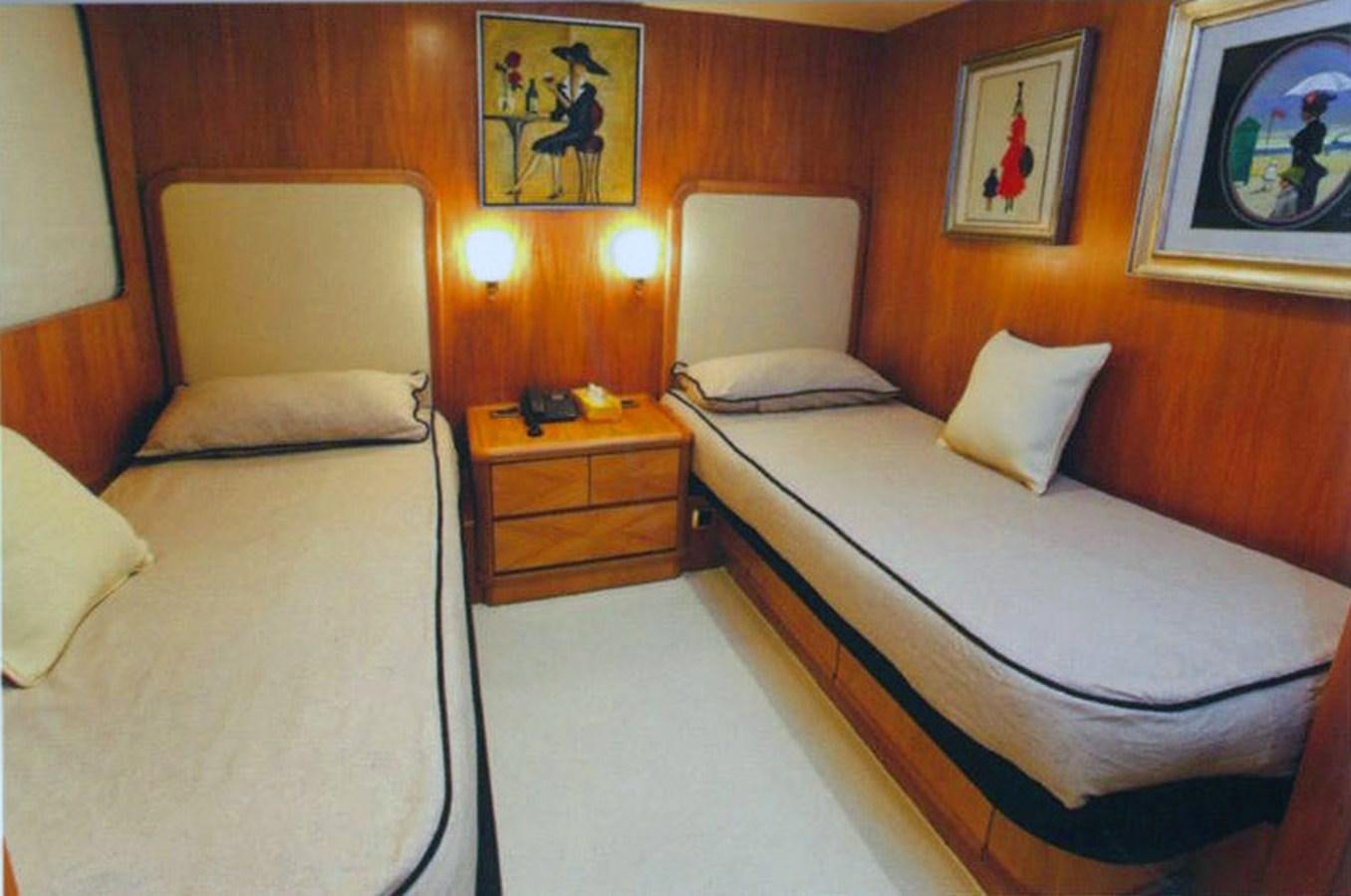 a couple of beds in a hotel room aboard GIAVA Yacht for Sale