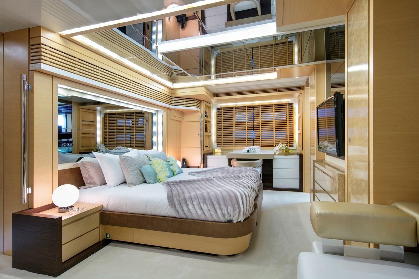 a large bedroom with a large bed aboard ASTRO Yacht for Sale