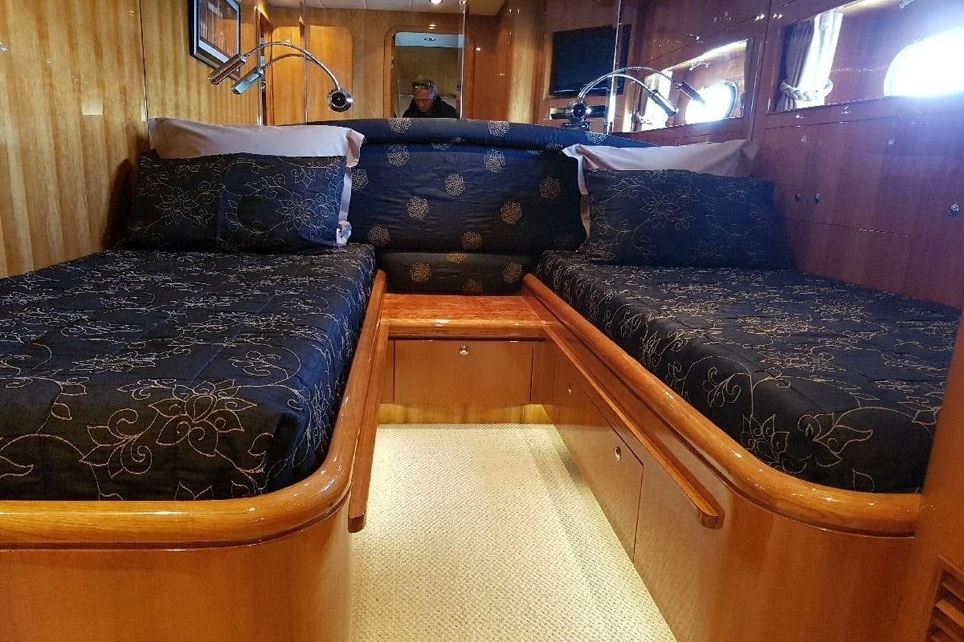 a room with a bed and a couch aboard TRIPLE 888 EIGHT Yacht for Sale