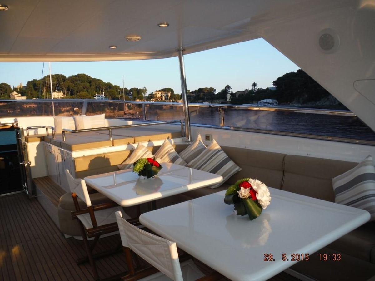 a room with tables and chairs aboard TRIPLE 888 EIGHT Yacht for Sale