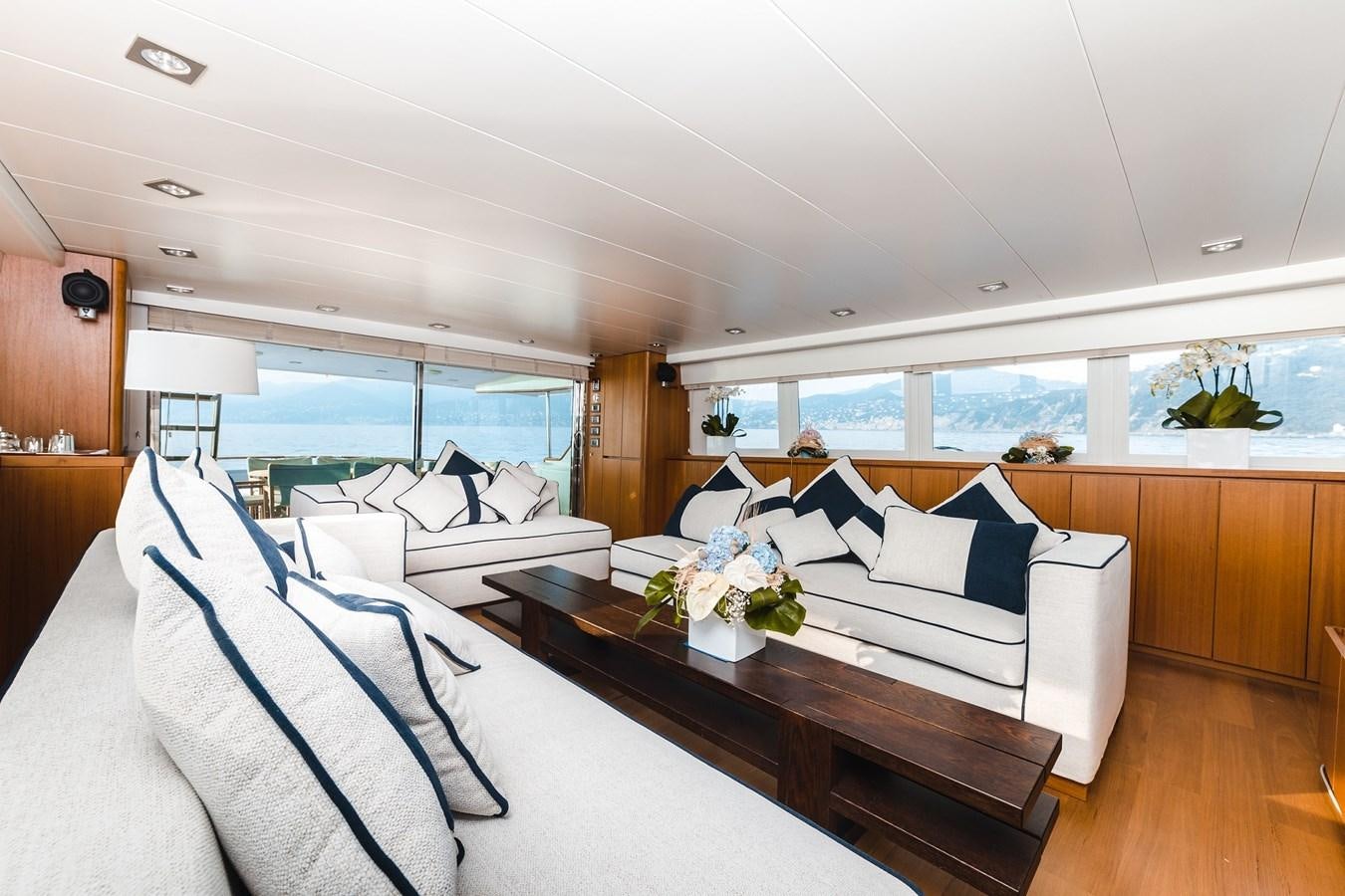 a room with a bed and a table aboard PAOLUCCI Yacht for Sale
