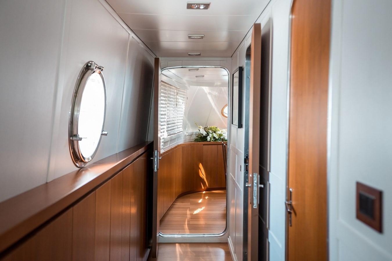 a hallway with a mirror and a door aboard PAOLUCCI Yacht for Sale