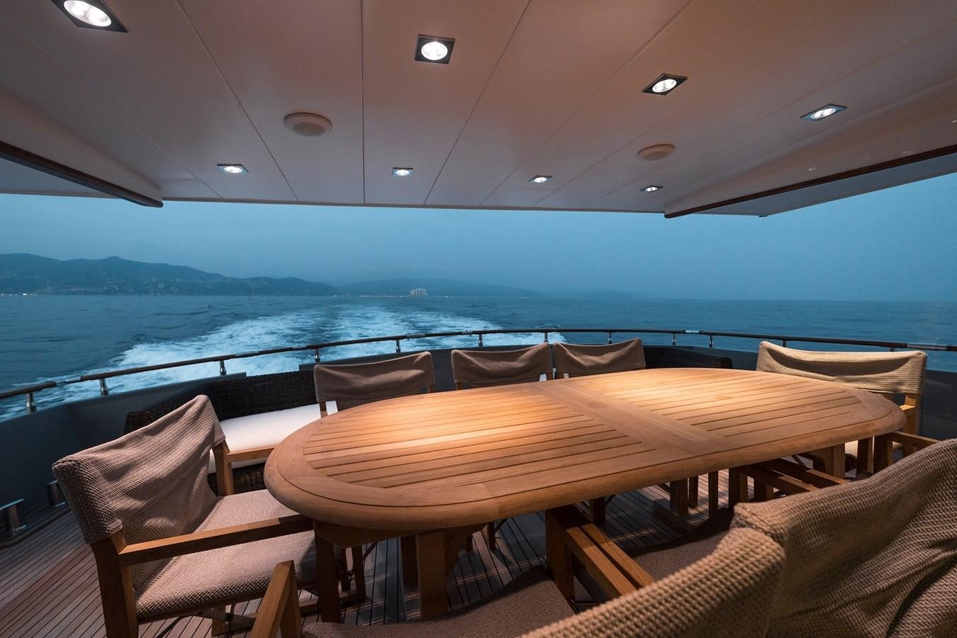 a table and chairs on a boat aboard PAOLUCCI Yacht for Sale