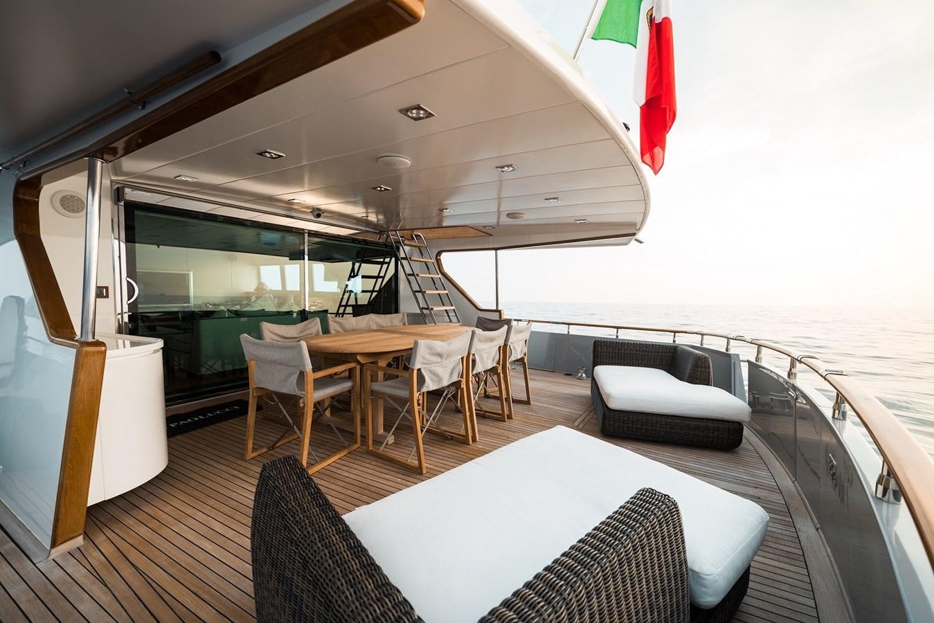 a room with a table and chairs aboard PAOLUCCI Yacht for Sale
