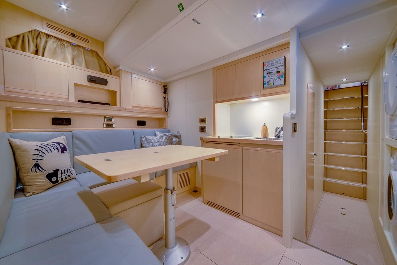 a room with a bed and a table aboard GERRY'S FERRY Yacht for Sale