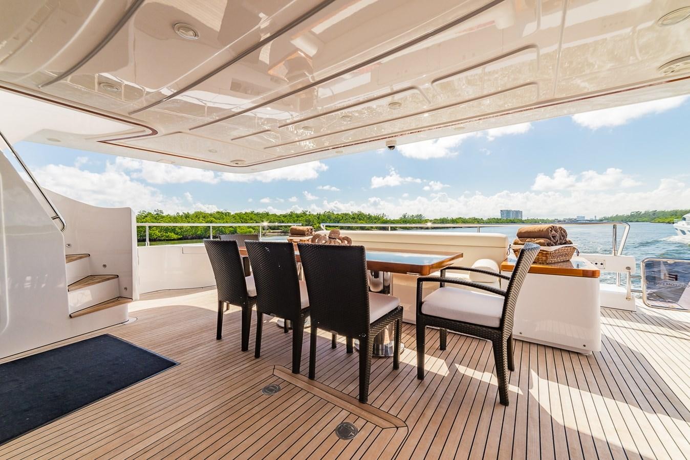 a room with a table and chairs aboard GERRY'S FERRY Yacht for Sale